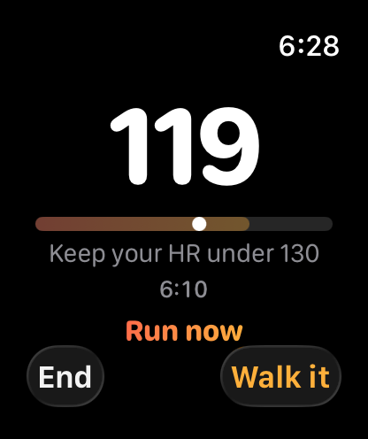 Apple Watch mid-run showing the First Gear coaching screen, heart rate and effort band front and center.